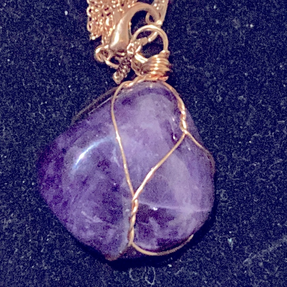 Gold wire amethyst stone pendant and marked Sterling silver chain